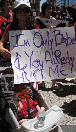 Alvarez with her youngest son, Daniel, during a march in August for the children of migrants detained during Arpaio's raids.