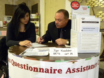 Census worker Igor Kazatsker helps Barno Akhundjanova, a 22-year old  student,  fill out the form. “This was my first time so I didn’t want to make a mistake,”  she said.  Photo: Ewa Kern-Jedrychowska 