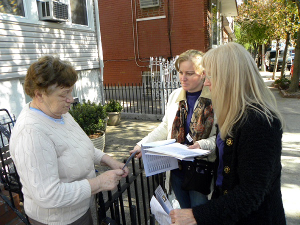 Anna Dziubek and Donna Klimas, Polish immigrants and members of Local 32BJ speak to a potential voter in Maspeth, Queens