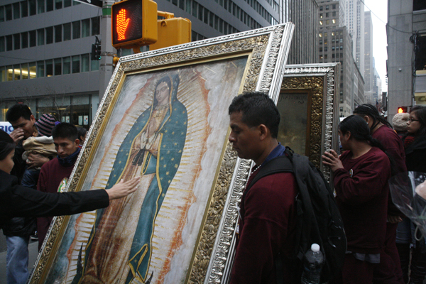 Mexican immigrants carried portraits of the Virgin of Guadalupe across 51st Street - Photo: Sarah Kramer