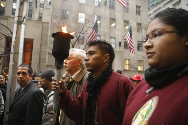 Torch bearers Javier Santos and Areceli Almaguer outside of Saint Patrick's Cathedral in New York - Photo: Sarah Kramer