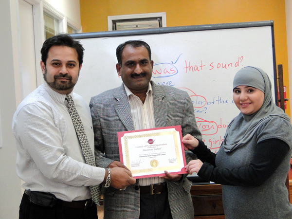 Mustansar Waheed proudly holds his certificate for passing a U.S. citizenship course - Photo: Mohsin Zaheer