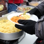 Inspired by Spiritual Leader, Immigrant Community Cooks Vegetarian Food for NYC Homeless