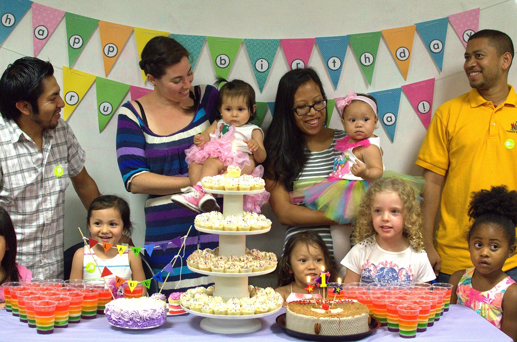Grace Andrews and Sara Markel-Gonzalez, with their family at daughters' joint birthday party. Photo by Lily Chin, lilychin.info