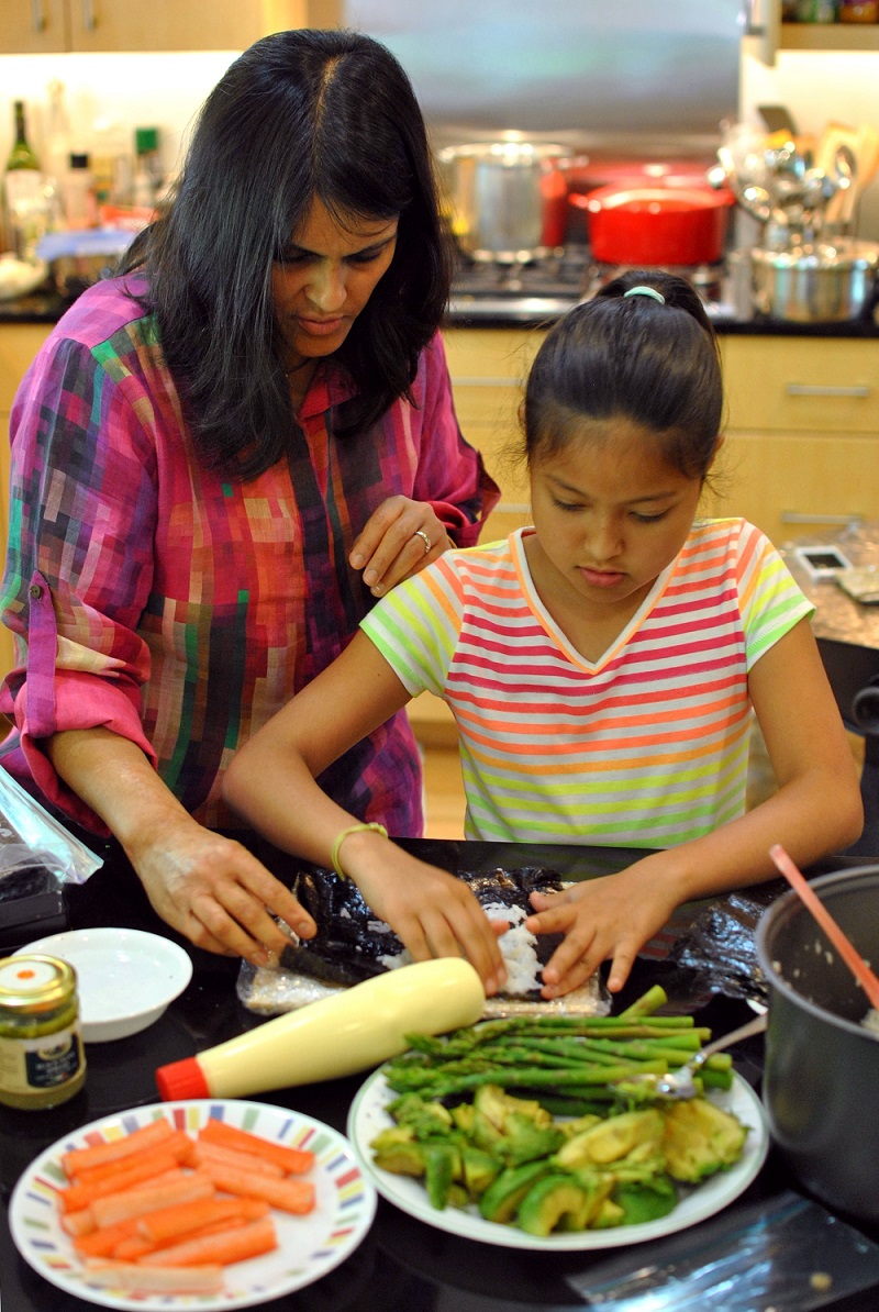 Sood Horiuchi teaches daughter to make California rolls